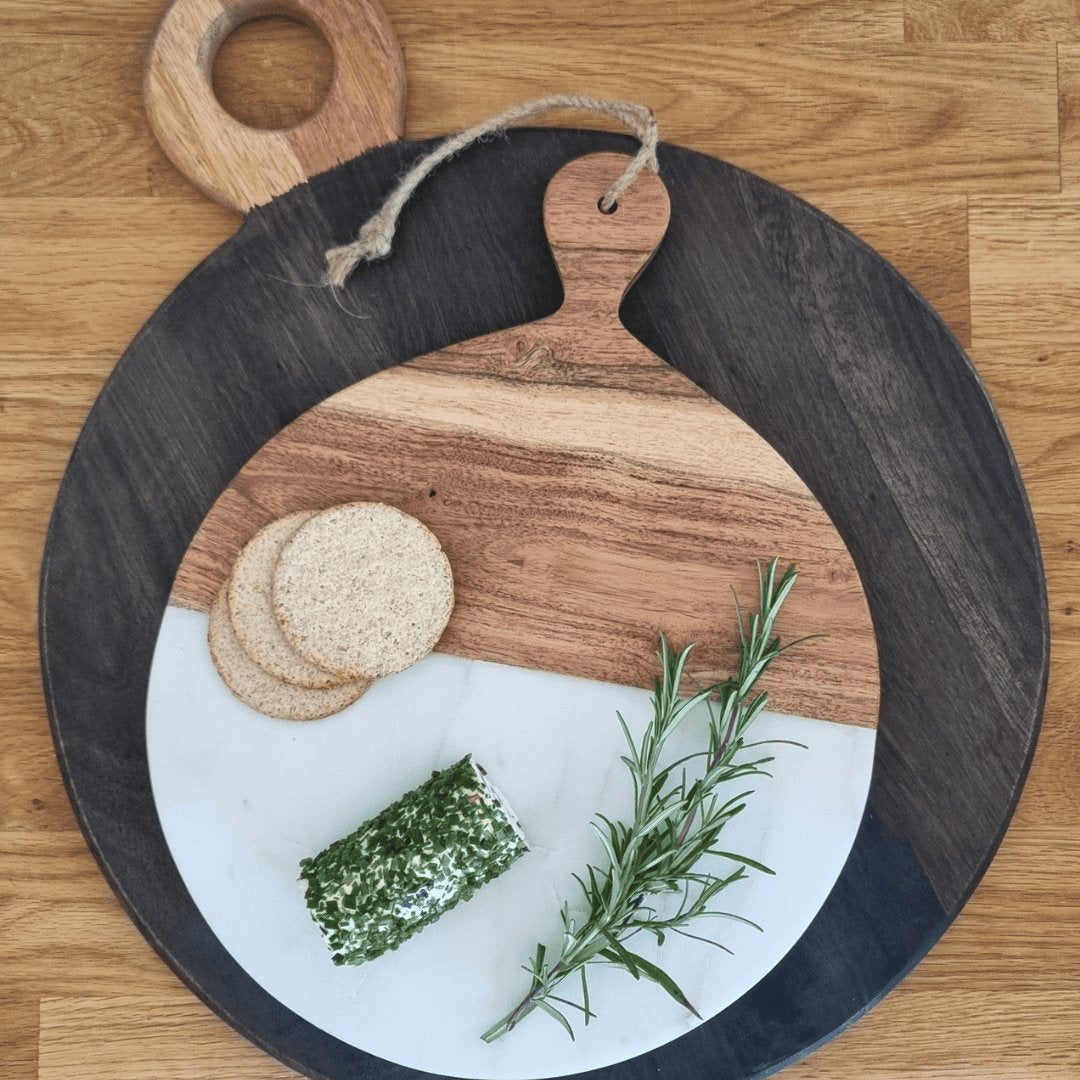 Two chopping boards on a wooden worktop